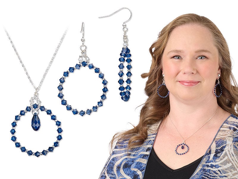 Model wearing necklace and earring made with sapphire colored crystal beads