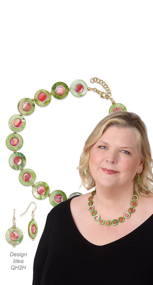 Model wearing necklace and earrings made with shell beads