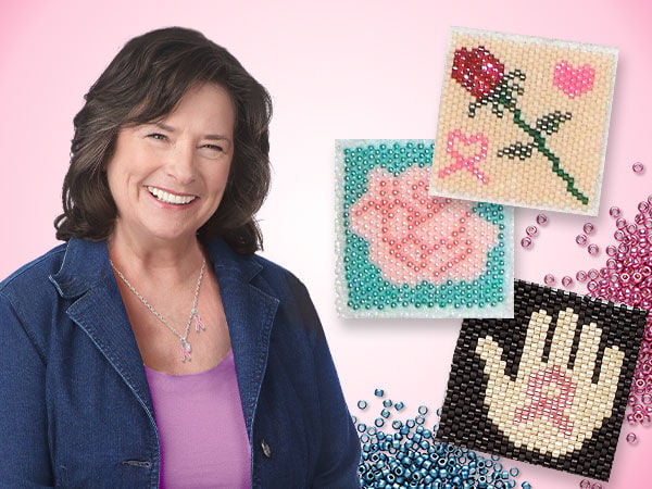 Woman in a purple shirt and denim blazer next to seed-beaded tiles representing flowers and pink ribbons for breast cancer awareness