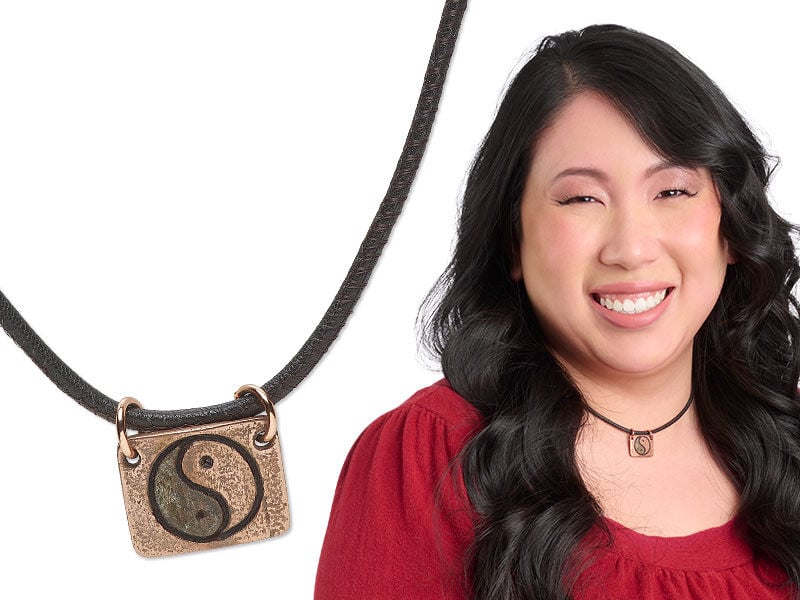 Model wearing necklace made with a metal clay pendant