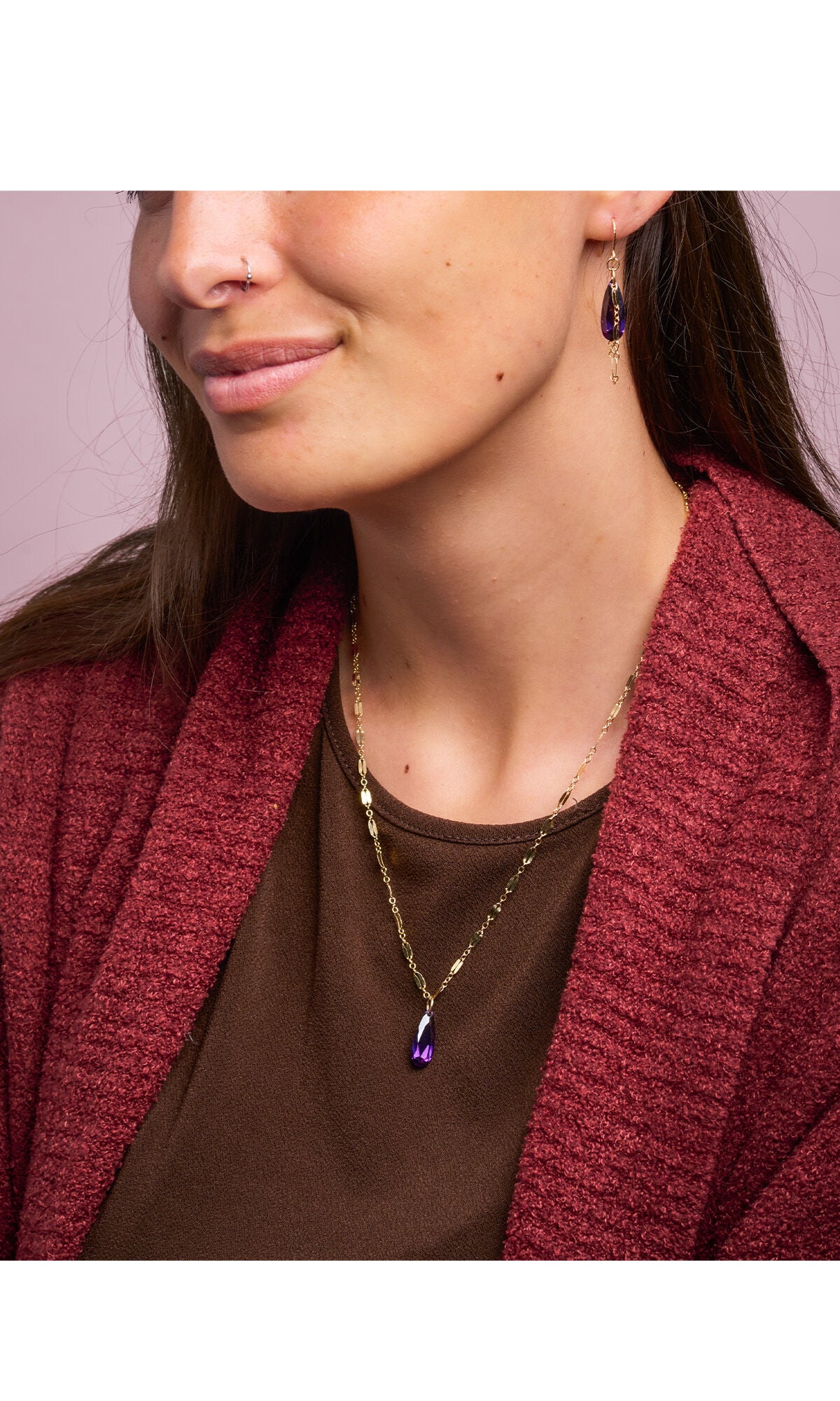 model in red sweater wearing necklace and earring set gold-filled chain and cubic zirconia