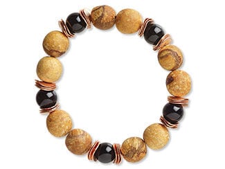 Design Idea Q C 2 M - Stretch bracelet features light wood round beads, black beads and copper-colored wavy discs