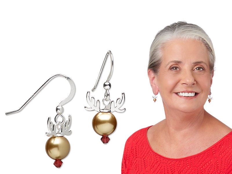 Model wearing earrings with fishhook ear wire
