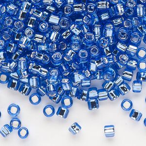 Seed bead, Dyna-Mites&trade;, glass, silver-lined translucent blue, #6 round with square hole. Sold per 1/2 kilogram pkg.