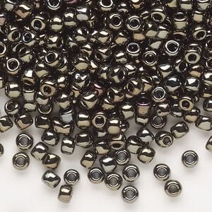 Seed bead, Dyna-Mites&trade;, glass, opaque iris gold, #6 round. Sold per 1/2 kilogram pkg.