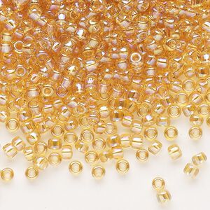 Seed bead, Dyna-Mites&trade;, glass, transparent rainbow amber yellow, #8 round. Sold per 1/2 kilogram pkg.