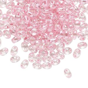 Seed bead, Preciosa Twin&trade; Czech glass, pkg/250g, 5x2.5mm oval, transparent pink terra color-lined clear, (38694).