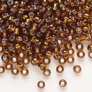 Seed bead, Dyna-Mites&trade;, glass, transparent silver-lined root beer, #6 round. Sold per 40-gram pkg.