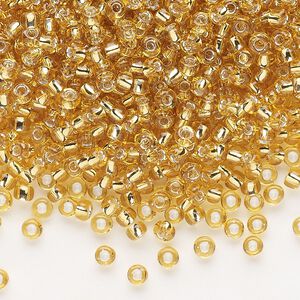Seed bead, Dyna-Mites&trade;, glass, silver-lined translucent medium gold, #8 round. Sold per 1/2 kilogram pkg.