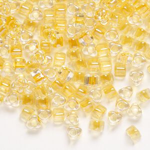 Seed bead, Miyuki, glass, transparent clear color-lined light gold, (TR1107), #5 triangle. Sold per 250-gram pkg.