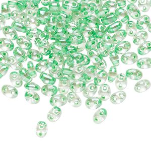 Seed bead, Preciosa Twin&trade; Czech glass, pkg/250g, 5x2.5mm oval, transparent light green terra color-lined clear, (38656).