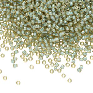 Seed bead, TOHO BEADS&reg;, glass, pkg/50g, #11 round, opaque color-lined seafoam light topaz (TR-11-952).