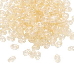 Seed bead, Preciosa Twin&trade; Czech glass, pkg/250g, 5x2.5mm oval, transparent light peach terra pearl clear, (08192).