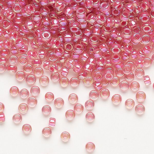 Seed bead, Miyuki, glass, pkg/50g, #8 rocaille, translucent hot pink-lined rainbow crystal clear (RR-355). image number 0