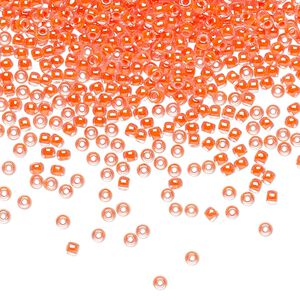 Seed bead, TOHO BEADS&reg;, glass, pkg/250g, #11 round, translucent luminous inside color neon salmon (TR-11-803).
