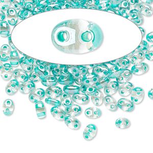 Seed bead, Preciosa Twin&trade; Czech glass, pkg/50g, 5x2.5mm oval, transparent green terra color-lined clear, (38658).