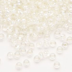 Seed bead, Preciosa Ornela Czech glass, pkg/50g, #6 rocaille, translucent color-lined luster pastel ivory, (382PI).