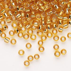 Seed bead, Dyna-Mites&trade;, glass, transparent silver-lined gold, #6 round. Sold per 40-gram pkg.