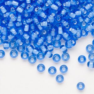 Seed bead, Preciosa Ornela, glass, transparent chalkwhite-lined light sapphire, #6 rocaille. Sold per 50-gram pkg.