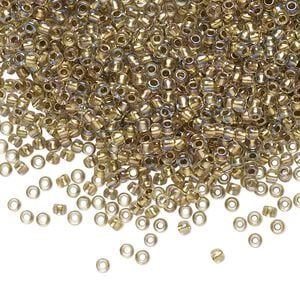 Seed bead, TOHO BEADS&reg;, glass, pkg/7.5g, #11 round, translucent gold-lined rainbow crystal clear (TR-11-262).