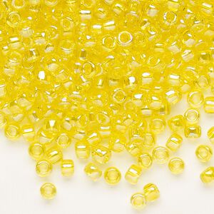 Seed bead, Dyna-Mites&trade;, glass, transparent rainbow yellow, #6 round. Sold per 1/2 kilogram pkg.