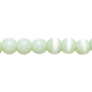 Bead, cat's eye glass (fiber optic glass), mint green, 6-8mm round. Sold per 14-inch strand, approximately 55 beads.