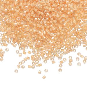 Seed bead, Delica&reg;, glass, pkg/7.5g, #11 round, translucent light peach-lined luster crystal clear (DB-0067).