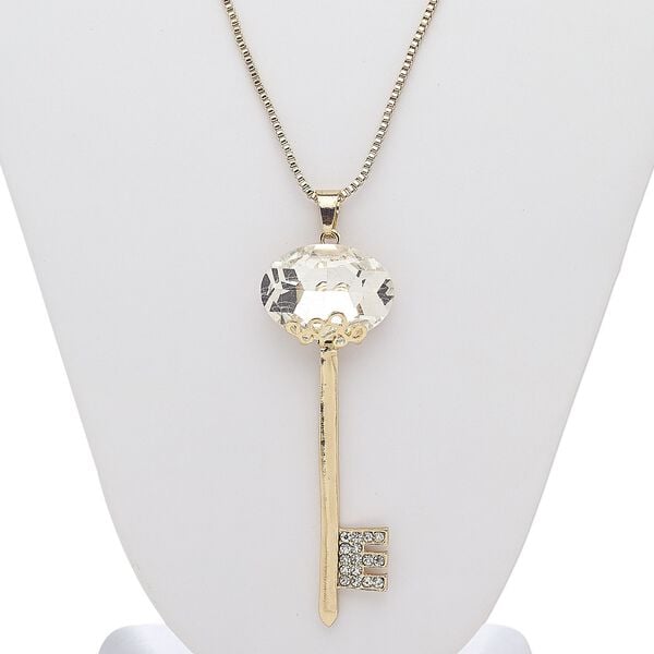 Necklace, glass rhinestone / glass / gold-finished steel / "pewter" (zinc-based alloy), clear, 3-1/4 x 1-inch key, 28 inches with 3-inch extender chain and lobster claw clasp. Sold individually. image number 0