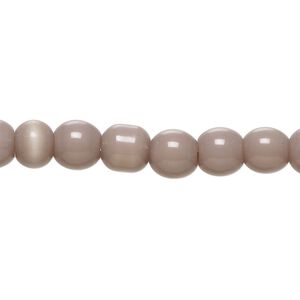 Bead, cat's eye glass (fiber optic glass), purple, 6-8mm irregular round. Sold per 14-inch strand, approximately 55 beads.