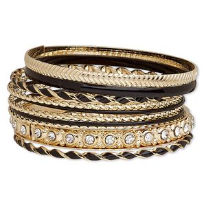 Bracelet, bangle, enamel / glass rhinestone / gold-finished steel, black and clear, 2-8mm wide with twist, 8 to 8-1/2 inches. Sold per 10-piece set.