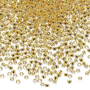 Seed bead, TOHO BEADS&reg;, glass, pkg/250g, #11 round, transparent 24Kt gold-lined crystal clear (TR-11-701).