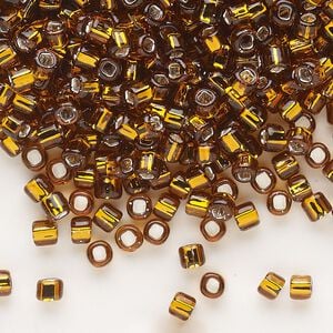 Seed bead, Dyna-Mites&trade;, glass, silver-lined translucent root beer, #6 round with square hole. Sold per 1/2 kilogram pkg.