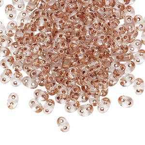 Seed bead, Preciosa Twin&trade; Czech glass, pkg/250g, 5x2.5mm oval, transparent copper color-lined clear, (68105).