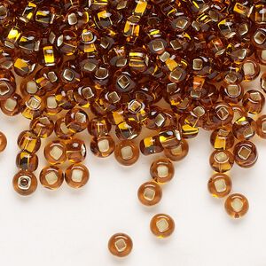 Seed bead, Preciosa Ornela Czech glass, pkg/500g, #6 rocaille, transparent silver-lined dark topaz, (17090).
