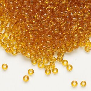 Seed bead, Dyna-Mites&trade;, glass, transparent amber yellow, #8 round. Sold per 1/2 kilogram pkg.