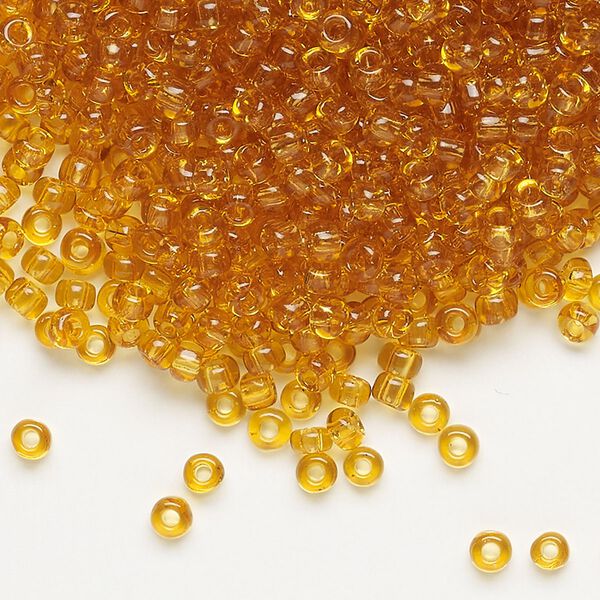 Seed bead, Dyna-Mites&trade;, glass, transparent amber yellow, #8 round. Sold per 1/2 kilogram pkg. image number 0