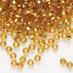 Seed bead, Preciosa Ornela Czech glass, pkg/50g, #6 rocaille, transparent silver-lined topaz, (17050).