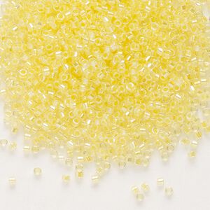 Seed bead, Delica&reg;, glass, pkg/7.5g, #11 round, translucent light yellow-lined rainbow crystal clear (DB-0053).
