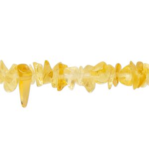 Bead, glass, translucent golden yellow, small to extra-large chip. Sold per 30-inch strand.