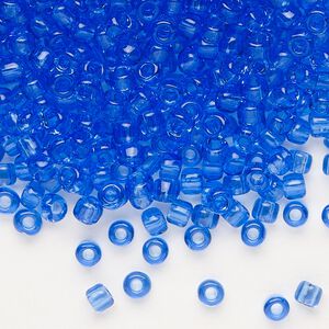 Seed bead, Dyna-Mites&trade;, glass, transparent light blue, #6 round. Sold per 1/2 kilogram pkg.