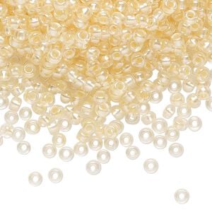 Seed bead, Preciosa Ornela Czech glass, pkg/500g, #8 rocaille, translucent color-lined luster pastel apricot, (382PA).