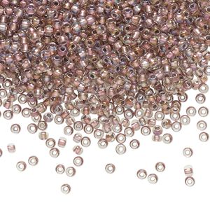 Seed bead, TOHO BEADS&reg;, glass, pkg/50g, #11 round, translucent rose gold-lined crystal clear (TR-11-267).