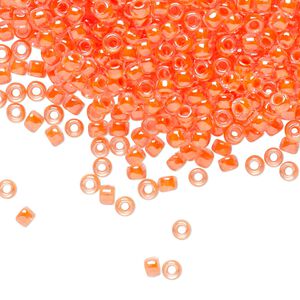 Seed bead, TOHO BEADS&reg;, glass, pkg/250g, #8 round, translucent luminous inside color neon salmon (TR-08-803).