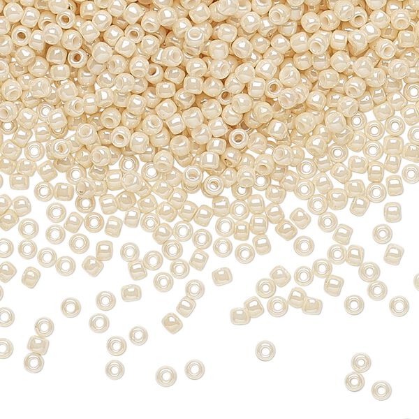 Seed bead, TOHO BEADS&reg;, glass, pkg/7.5g, #11 round, opaque luster light beige (TR-11-123). image number 0