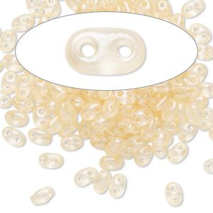 Seed bead, Preciosa Twin&trade; Czech glass, pkg/10g, 5x2.5mm oval, translucent light peach terra pearl clear, (08192).