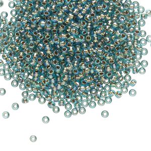 Seed bead, TOHO BEADS&reg;, glass, pkg/50g, #11 round, translucent gold-lined rainbow aqua (TR-11-995).