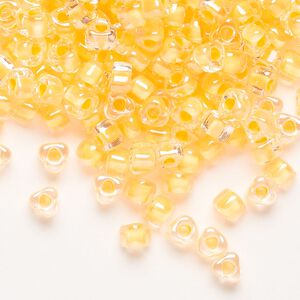 Seed bead, Miyuki, glass, transparent clear color-lined yellow, (TR1121), #5 triangle. Sold per 250-gram pkg.