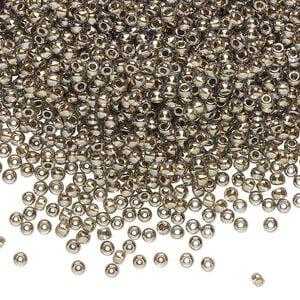 Seed bead, TOHO BEADS&reg;, glass, pkg/50g, #11 round, transparent gold-lined black diamond (TR-11-993).