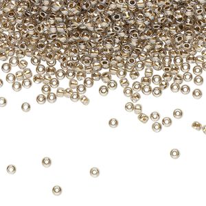 Seed bead, TOHO BEADS&reg;, glass, pkg/50g, #11 round, transparent gold-lined crystal clear (TR-11-989).