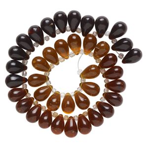 Bead, glass, transparent amber, brown and dark brown, 16x10mm top-drilled teardrop with irregular rondelles. Sold per 14-inch strand.